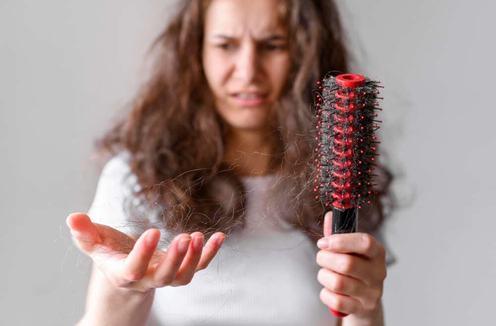 Dr. Ankit Mehra explaining common causes of hair loss