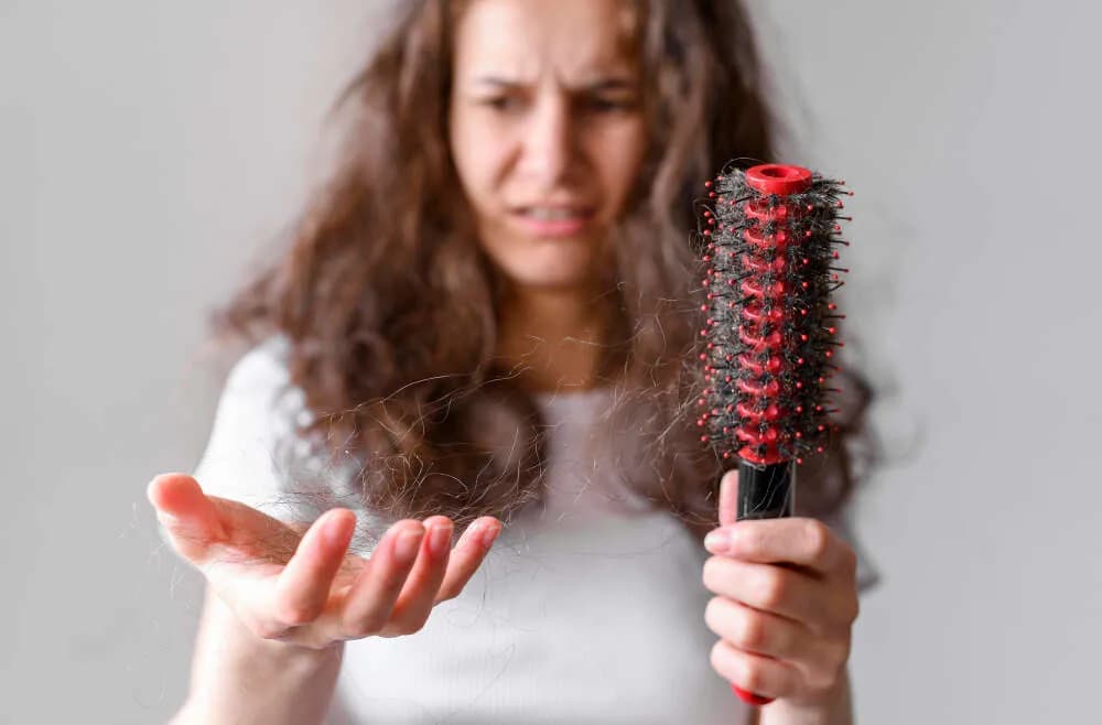 Dr. Anju Mehra explaining common causes of hair loss